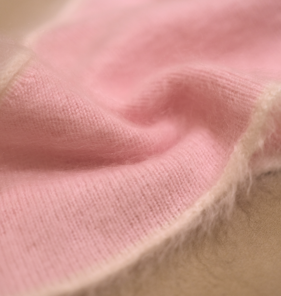 Pink cashmere knit with a softly raised edge